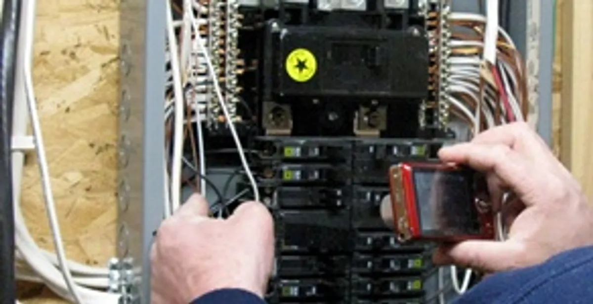 Home electrical inspection of circuit breaker panel by licensed electrician in Mesa, AZ