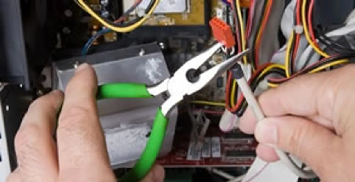 Licensed electrical contractor performing electrical repair with tools in Fountain Hills, AZ