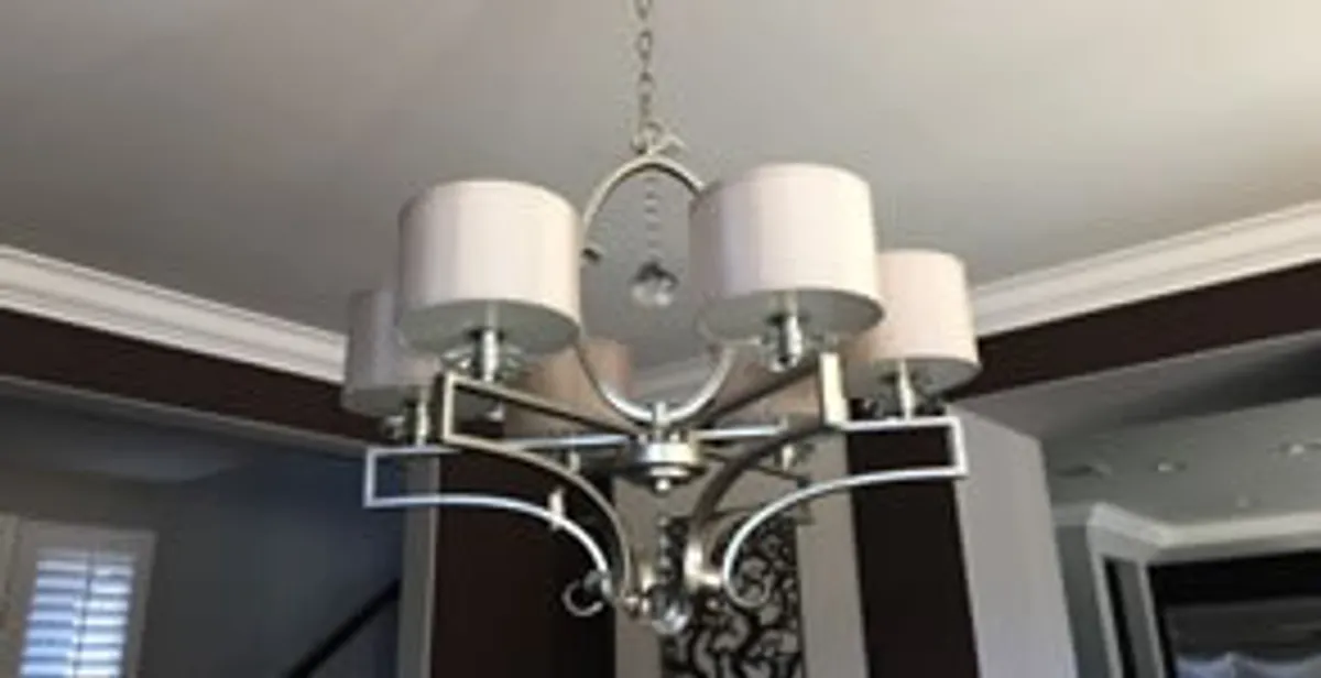 Modern chandelier installation with multiple light fixtures in Mesa, AZ